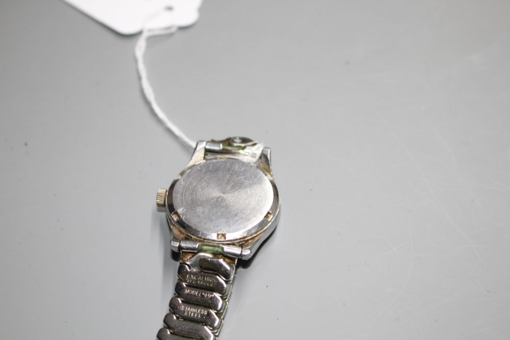 A gentlemans early 1940s stainless steel mid-size Omega manual wind wrist watch, on associated bracelet.